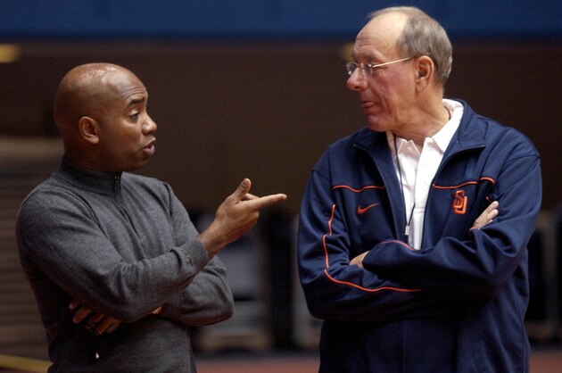 Syracuse University athletic director Daryl Gross, left, talks with basketball coach Jim Boeheim during practice in Syracuse, N.Y., Thursday, Oct. 27, 2005. By selling new courtside seats for home basketball games this season, Gross has been able to give Boeheim a pay raise. (AP Photo/Kevin Rivoli)