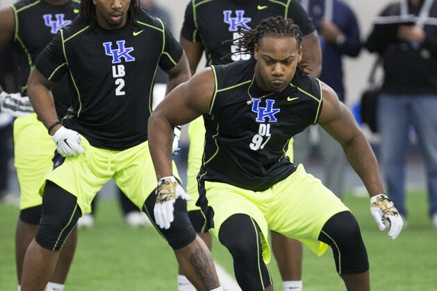 Bud Dupree, left, and Za'Darius Smith run through an agility drill during NFL football Pro Day at the University of Kentucky in Lexington, Ky., Thursday, March 12, 2015. (AP Photo/David Stephenson)