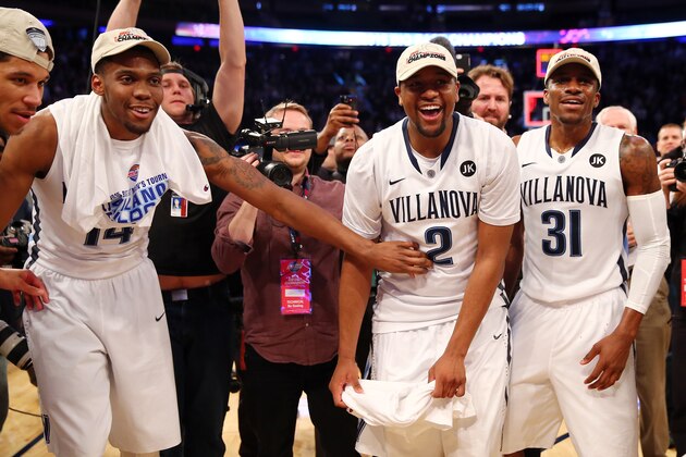 NEW YORK, NY - MARCH 14: Darryl Reynolds #14, Kris Jenkins #2, and Dylan Ennis #31 of the Villanova Wildcats celebrate after defeating the Xavier Musketeers 69-52 in the championship game of the Big East basketball tournament at Madison Square Garden on March 14, 2015 in New York City.  (Photo by Elsa/Getty Images)