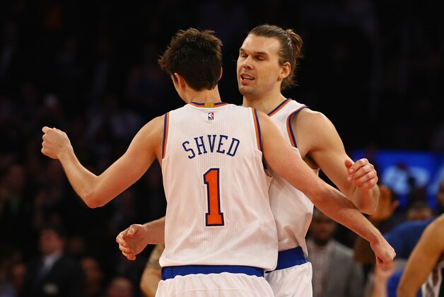 NEW YORK, NY - MARCH 17:  Lou Amundson #21 of the New York Knicks celebrates his game tying basket with Alexey Shved #1 forcing the game into overtime against the San Antonio Spurs during their game at Madison Square Garden on March 17, 2015 in New York City.  NOTE TO USER: User expressly acknowledges and agrees that, by downloading and/or using this photograph, user is consenting to the terms and conditions of the Getty Images License Agreement.  (Photo by Al Bello/Getty Images)