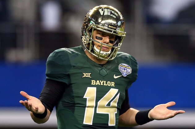 ARLINGTON, TX - JANUARY 01:  Bryce Petty #14 of the Baylor Bears reacts after throwing a touchdown pass to KD Cannon #9 of the Baylor Bears against the  Michigan State Spartans during the second half of the Goodyear Cotton Bowl Classic at AT&T Stadium on January 1, 2015 in Arlington, Texas.  (Photo by Ronald Martinez/Getty Images)