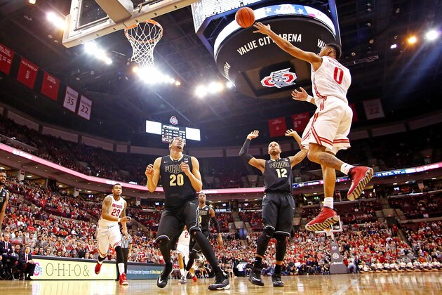 COLUMBUS, OH - MARCH 1:  D'Angelo Russell #0 of the Ohio State Buckeyes shoots and scores while being defended by A.J. Hammons #20 and Vince Edwards #12 of the Purdue Boilermakers during the second half at Value City Arena on March 1, 2015 in Columbus, Ohio. Ohio State defeated Purdue 65-61. (Photo by Kirk Irwin/Getty Images)