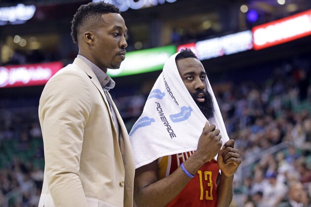 Houston Rockets' James Harden, right, and tDwight Howard walk back to the bench late the fourth quarter of an NBA basketball game against the Utah Jazz on Thursday, March 12, 2015, in Salt Lake City. The Jazz won 109-91. (AP Photo/Rick Bowmer)