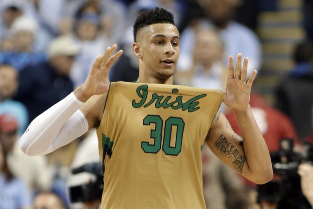 Notre Dame's Zach Auguste (30) celebrates after an NCAA college basketball game against North Carolina in the championship of the Atlantic Coast Conference tournament Saturday, March 14, 2015, in Greensboro, N.C. Notre Dame won 90-82. (AP Photo/Bob Leverone)
