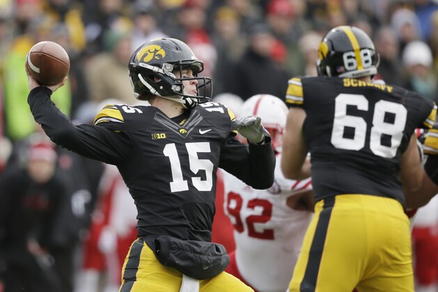 Iowa quarterback Jake Rudock (15) throws a pass during the second half of an NCAA college football game against Nebraska, Friday, Nov. 28, 2014, in Iowa City, Iowa. Nebraska won 37-34 in overtime. (AP Photo/Charlie Neibergall)