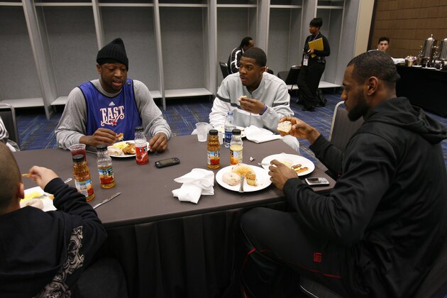 NEW ORLEANS - FEBRUARY 16:  (L-R) Dwyane Wade, Joe Johnson and LeBron James of the East All-Stars eat breakfast prior to the East All-Stars Practice on center court at NBA Jam Session presented by Addidas at the Earnest N. Morial Convention Center February 16, 2008 in New Orleans, Louisiana. NOTE TO USER: User expressly acknowledges and agrees that, by downloading and or using this Photograph, user is consenting to the terms and conditions of the Getty Images License Agreement.   Mandatory Copyright Note: Copyright 2008 NBAE (Photo by Bill Baptist/NBAE via Getty Images)