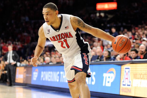 Feb 19, 2015; Tucson, AZ, USA; Arizona Wildcats forward Brandon Ashley (21) prepares to pass during the second half against the Southern California Trojans at McKale Center. Arizona won 57-87. Mandatory Credit: Casey Sapio-USA TODAY Sports
