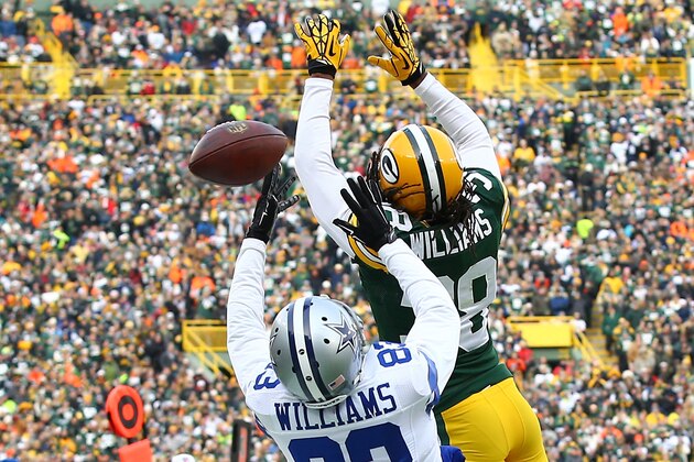 GREEN BAY, WI - JANUARY 11:  Tramon Williams #38 of the Green Bay Packers breaks up a pass intended for  Terrance Williams #83 of the Dallas Cowboys in the second quarter of the 2015 NFC Divisional Playoff game at Lambeau Field on January 11, 2015 in Green Bay, Wisconsin.  (Photo by Al Bello/Getty Images)