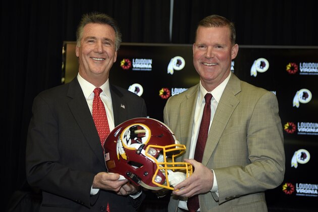 Washington Redskins president Bruce Allen, left, poses with new general manager Scot McCloughan, right, at an NFL football press conference where McCloughan was introduced as the Washington Redskins new general manager, Friday, Jan. 9, 2015, in Ashburn, Va. (AP Photo/Nick Wass)