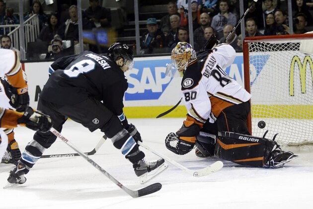 San Jose Sharks' Joe Pavelski (8) scores past Anaheim Ducks goalie Ilya Bryzgalov during the first period of an NHL hockey game Thursday, Jan. 29, 2015, in San Jose, Calif. (AP Photo/Marcio Jose Sanchez)