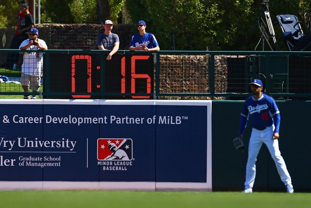 Mar 4, 2015; Phoenix, AZ, USA; Detailed view of the pitch/between inning clock in the outfield as Los Angeles Dodgers outfielder Andre Ethier waits for the inning to start against the Chicago White Sox during a spring training baseball game at Camelback Ranch. Mandatory Credit: Mark J. Rebilas-USA TODAY Sports