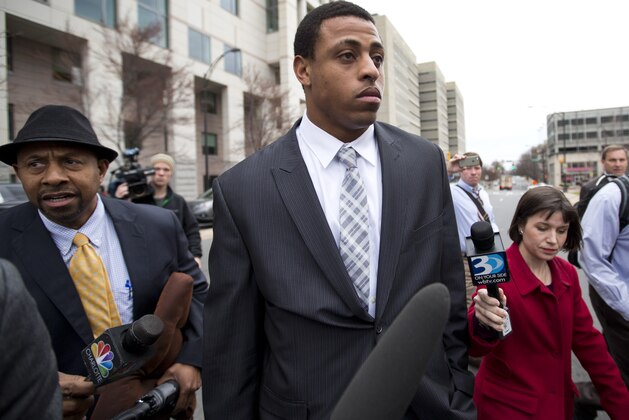 Carolina Panthers' Greg Hardy leaves the Mecklenburg County Courthouse after his domestic violence charges were dismissed in Charlotte, N.C., Monday, Feb. 9, 2015. (AP Photo/Chris Keane)