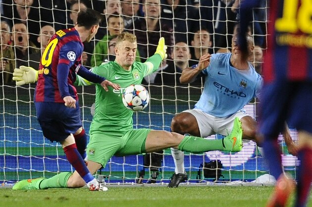 Manchester City's goalkeeper Joe Hart, center, and Manchester City's Vincent Kompany, right, save against Barcelona's Lionel Messi, left, during a Champions League round of 16 second leg, soccer match between FC Barcelona and Manchester City at Camp Nou stadium, in Barcelona, Spain, Wednesday, March 18, 2015. (AP Photo/Manu Fernandez)