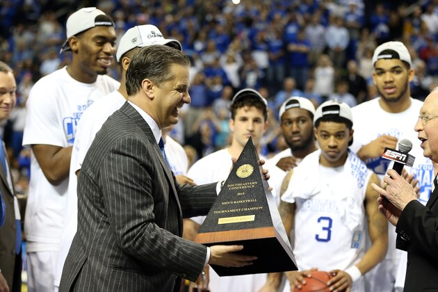 NASHVILLE, TN - MARCH 15:  Head coach John Calipari of the Kentucky Wildcats celebrates on the court with his team after defeating the Arkansas Razorbacks 78-63 in the championship game of the SEC basketball tournament at Bridgestone Arena on March 15, 2015 in Nashville, Tennessee.  (Photo by Andy Lyons/Getty Images)