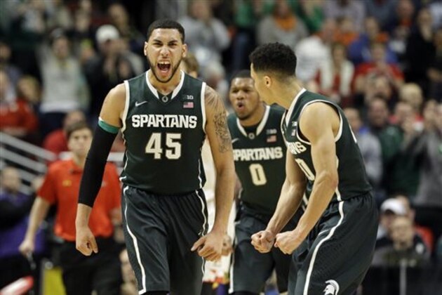 Michigan State's Denzel Valentine (45),  Marvin Clark Jr. (0) and  Travis Trice (20) celebrate as they took the lead against Maryland in the second  half of an NCAA college basketball game in the semifinals of the Big Ten Conference tournament in Chicago, Saturday, March 14, 2015. (AP Photo/Nam Y. Huh)