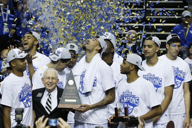 Kentucky forward Willie Cauley-Stein holds the trophy after the NCAA college basketball Southeastern Conference tournament championship game against Arkansas, Sunday, March 15, 2015, in Nashville, Tenn. Kentucky won 78-63. (AP Photo/Steve Helber)