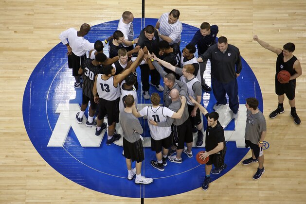 Butler coach Chris Holtmann gathers his team at mid-court following a practice for an NCAA college basketball second round game in Pittsburgh Wednesday, March 18, 2015. Texas plays Butler on Thursday. (AP Photo/Gene J. Puskar)