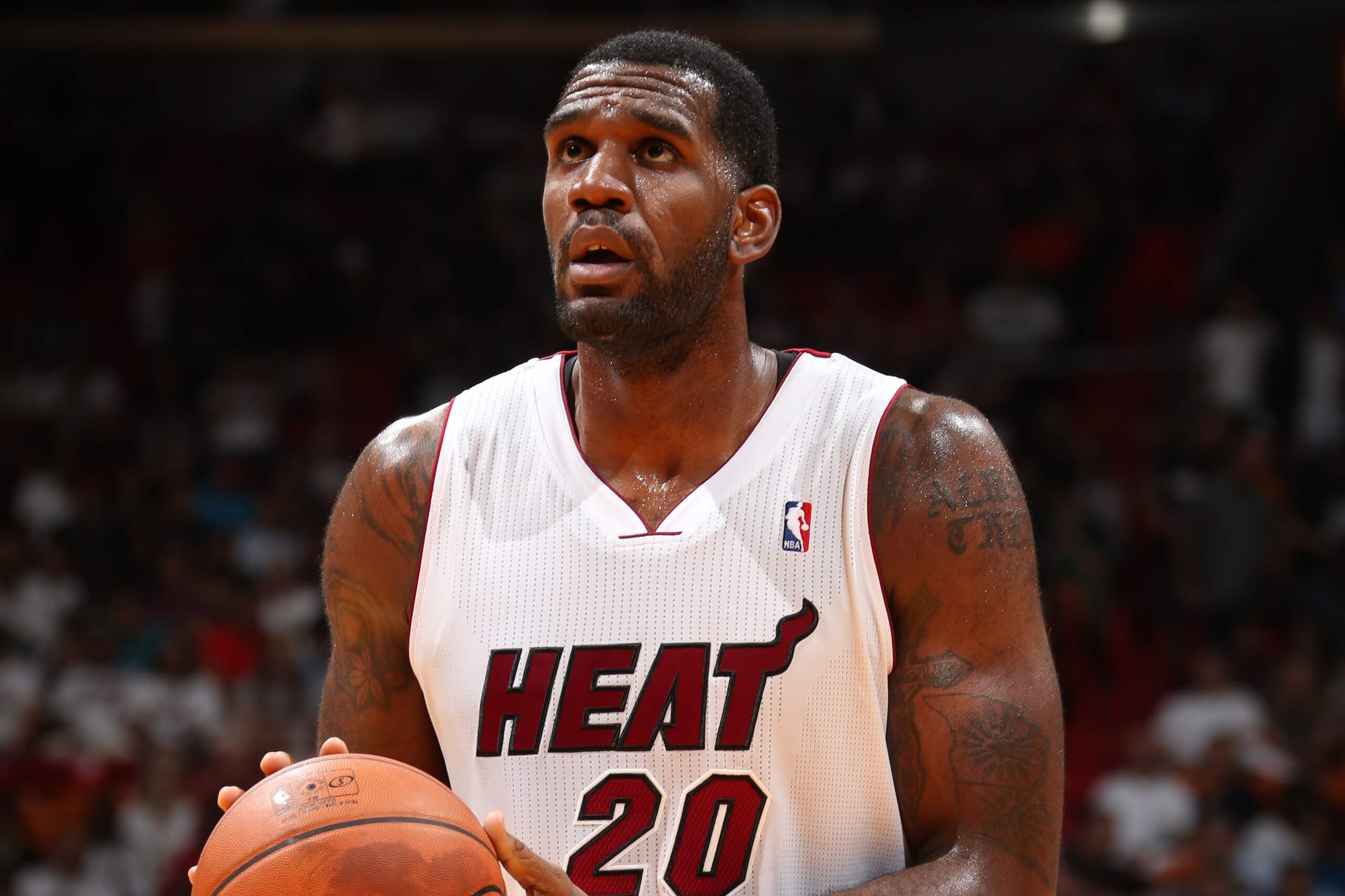 MIAMI, FL - MARCH 21: Greg Oden #20 of the Miami Heat takes a free throw against the Memphis Grizzlies on March 21, 2014 at American Airlines Arena in Miami, Florida. NOTE TO USER: User expressly acknowledges and agrees that, by downloading and or using this photograph, User is consenting to the terms and conditions of the Getty Images License Agreement. Mandatory Copyright Notice: Copyright 2014 NBAE (Photo by Joe Murphy/NBAE via Getty Images)