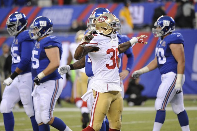 San Francisco 49ers defensive back Dontae Johnson (36) celebrates after the New York Giants failed to score on fourth down during the second half of an NFL football game Sunday, Nov. 16, 2014, in East Rutherford, N.J.  (AP Photo/Bill Kostroun)