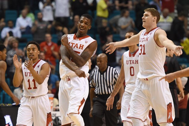 LAS VEGAS, NV - MARCH 12:  (L-R) Brandon Taylor #11, Delon Wright #55 and Dallin Bachynski #31 of the Utah Utes celebrate late in their quarterfinal game of the Pac-12 Basketball Tournament against the Stanford Cardinal at the MGM Grand Garden Arena on March 12, 2015 in Las Vegas, Nevada. Utah won 80-56.  (Photo by Ethan Miller/Getty Images)