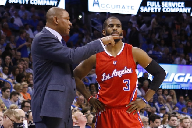Los Angeles Clippers head coach Doc Rivers coaches Los Angeles Clippers guard Chris Paul (3) during the first half of a NBA basketball game in Oklahoma City, Wednesday, March 11, 2015. Los Angeles Clippers won 120-108. (AP Photo/Alonzo Adams)
