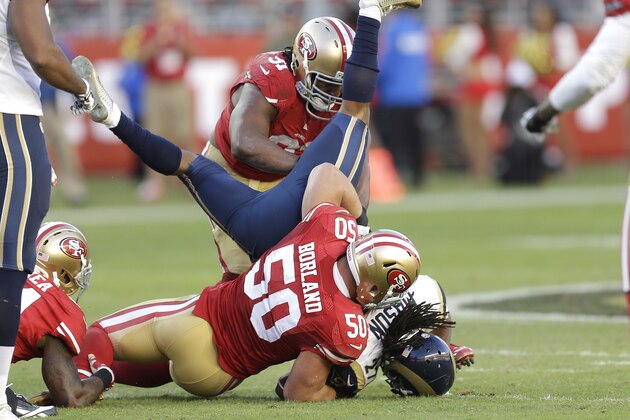 San Francisco 49ers inside linebacker Chris Borland (50) tackles St. Louis Rams running back Tre Mason during the fourth quarter of an NFL football game in Santa Clara, Calif., Sunday, Nov. 2, 2014. (AP Photo/Ben Margot)