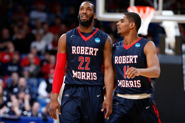 DAYTON, OH - MARCH 18: Rodney Pryor #11 speaks with Lucky Jones #22 of the Robert Morris Colonials against the North Florida Ospreys during the first round of the 2015 NCAA Men's Basketball Tournament at UD Arena on March 18, 2015 in Dayton, Ohio.  (Photo by Joe Robbins/Getty Images)