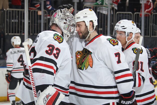 NEW YORK, NY - MARCH 18:  Scott Darling #33 and Brent Seabrook #7 of the Chicago Blackhawks celebrate after a 1-0 win over the New York Rangers at Madison Square Garden on March 18, 2015 in New York City. (Photo by Jared Silber/NHLI via Getty Images)