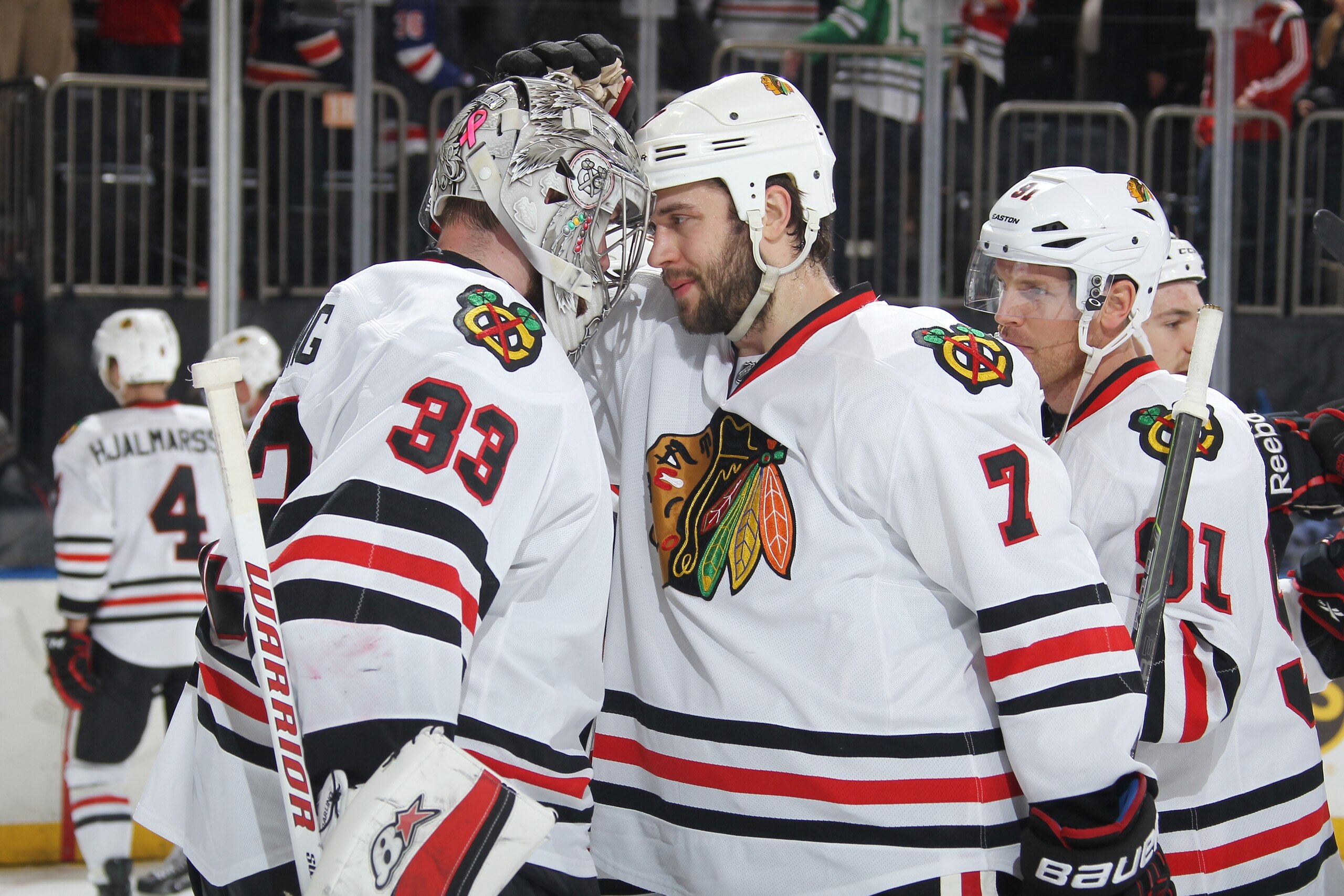 NEW YORK, NY - MARCH 18:  Scott Darling #33 and Brent Seabrook #7 of the Chicago Blackhawks celebrate after a 1-0 win over the New York Rangers at Madison Square Garden on March 18, 2015 in New York City. (Photo by Jared Silber/NHLI via Getty Images)