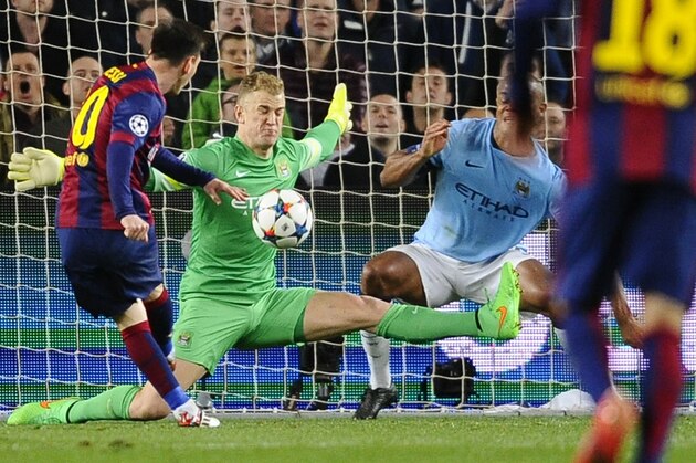 Manchester City's goalkeeper Joe Hart, center, and Manchester City's Vincent Kompany, right, save against Barcelona's Lionel Messi, left, during a Champions League round of 16 second leg, soccer match between FC Barcelona and Manchester City at Camp Nou stadium, in Barcelona, Spain, Wednesday, March 18, 2015. (AP Photo/Manu Fernandez)