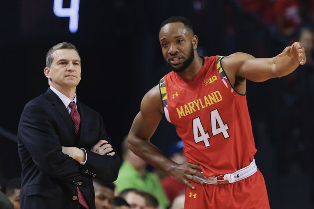 Maryland coach Mark Turgeon, left, and Maryland's Dez Wells (44) talk on the sideline during the first half of an NCAA college basketball game against Nebraska in Lincoln, Neb., Sunday, March 8, 2015. (AP Photo/Nati Harnik)