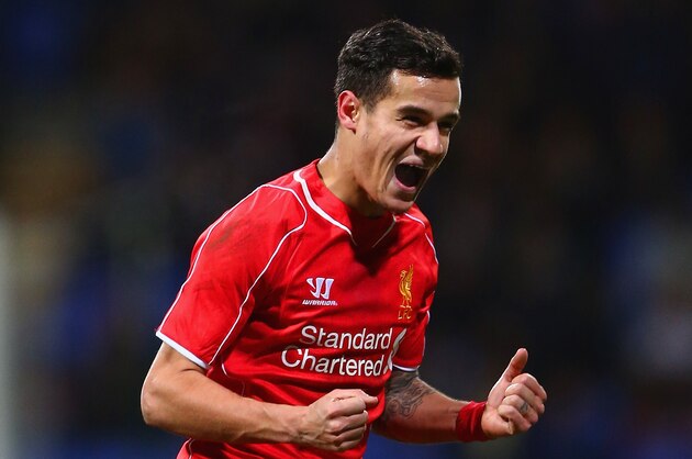 BOLTON, ENGLAND - FEBRUARY 04:  Philippe Coutinho of Liverpool celebrates scoring their second goal during the FA Cup Fourth round replay between Bolton Wanderers and Liverpool at Macron Stadium on February 4, 2015 in Bolton, England.  (Photo by Michael Steele/Getty Images)
