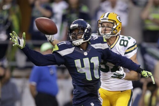 Seattle Seahawks cornerback Byron Maxwell (41) breaks up a pass intended for Green Bay Packers wide receiver Jordy Nelson (87) during the second half of an NFL football game, Thursday, Sept. 4, 2014, in Seattle. (AP Photo/Stephen Brashear)