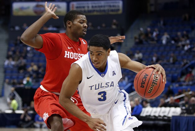 Mar 13, 2015; Hartford, CT, USA; Tulsa Golden Hurricane guard Shaquille Harrison (3) drives the ball against Houston Cougars guard Cavon Baker (3) in the second half during the quarterfinal round of the American Conference Tournament at XL Center. Tulsa defeated Houston 59-51. Mandatory Credit: David Butler II-USA TODAY Sports