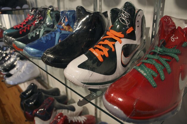 In this photo taken Feb. 28, 2012, limited edition sneakers, wrapped in plastic to protect them, sit in a Chicago consignment store.