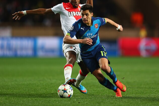MONACO - MARCH 17:  Alexis Sanchez of Arsenal takes on Geoffrey Kondogbia of Monaco during the UEFA Champions League round of 16 second leg match between AS Monaco and Arsenal at Stade Louis II on March 17, 2015 in Monaco, Monaco.  (Photo by Michael Steele/Getty Images)