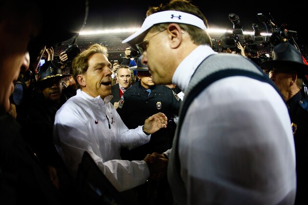 TUSCALOOSA, AL - NOVEMBER 29:  Head coach Nick Saban of the Alabama Crimson Tide shakes hand with head coach Gus Malzahn of the Auburn Tigers after the Iron Bowl at Bryant-Denny Stadium on November 29, 2014 in Tuscaloosa, Alabama. The Alabama Crimson Tide defeated the Auburn Tigers 55 to 44.  (Photo by Kevin C. Cox/Getty Images)