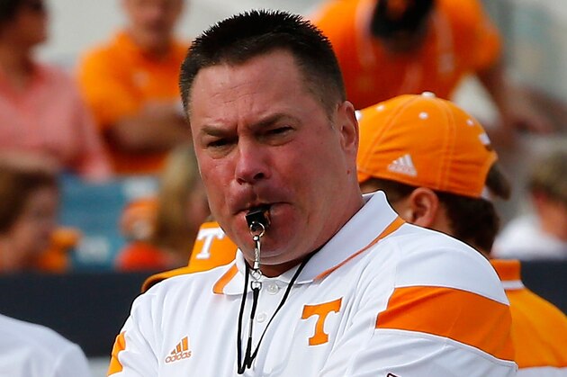 JACKSONVILLE, FL - JANUARY 02:  Head coach Butch Jones of the Tennessee Volunteers watches his team warmup before the TaxSlayer Bowl against the Iowa Hawkeyes at EverBank Field on January 2, 2015 in Jacksonville, Florida.  (Photo by Sam Greenwood/Getty Images)