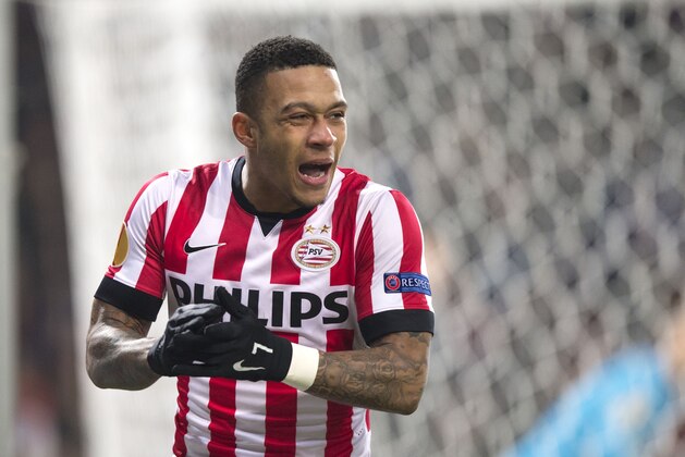 PSV’s Memphis Depay reacts after missing an opportunity to score during the first leg of the round of 32 Europa League match between PSV Eindhoven and Zenith Saint Petersburg, at Philips stadium, in Eindhoven, Netherlands, Thursday Feb. 19, 2015. (AP Photo/Ermindo Armino)