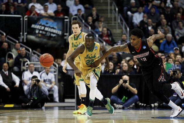 PITTSBURGH, PA - MARCH 19:  Quincy Ford #12 of the Northeastern Huskies turns over the ball to Jerian Grant #22 of the Notre Dame Fighting Irish in the second half during the second round of the 2015 NCAA Men's Basketball Tournament at Consol Energy Center on March 19, 2015 in Pittsburgh, Pennsylvania.  (Photo by Justin K. Aller/Getty Images)