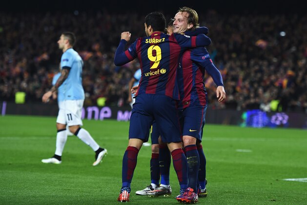 BARCELONA, SPAIN - MARCH 18:  Ivan Rakitic of Barcelona (R) celebrates scoring the opening goal with Neymar and Luis Suarez of Barcelona during the UEFA Champions League Round of 16 second leg match between Barcelona and Manchester City at Camp Nou on March 18, 2015 in Barcelona, Spain.  (Photo by Michael Regan/Getty Images)