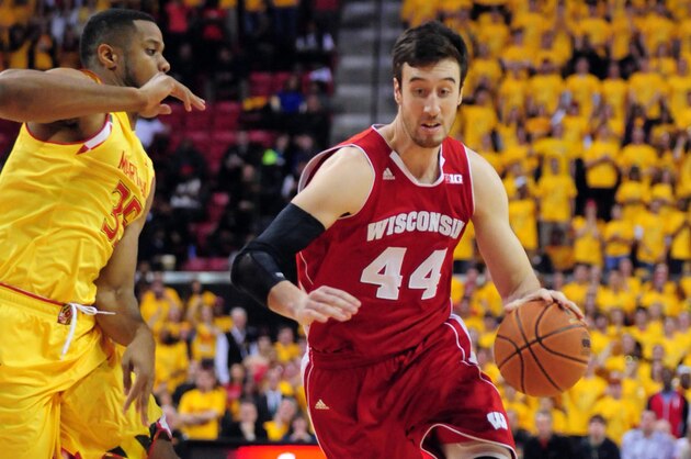 Feb 24, 2015; College Park, MD, USA; Wisconsin Badgers forward Frank Kaminsky (44) is defended by Maryland Terrapins forward Damonte Dodd (35) in the first half at Xfinity Center. Mandatory Credit: Evan Habeeb-USA TODAY Sports