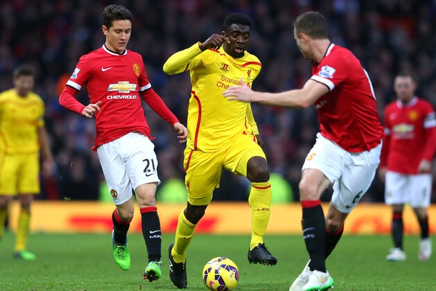 MANCHESTER, ENGLAND - DECEMBER 14:  Kolo Toure of Liverpool competes with Ander Herrera of Manchester United during the Barclays Premier League match between Manchester United and Liverpool at Old Trafford on December 14, 2014 in Manchester, England.  (Photo by Alex Livesey/Getty Images)