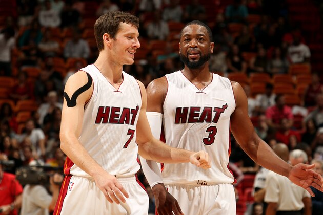 MIAMI, FL - MARCH 11: Goran Dragic #7 and Dwyane Wade #3 of the Miami Heat speak during a game against the Brooklyn Nets on March 11, 2015 at American Airlines Arena in Miami, Florida. NOTE TO USER: User expressly acknowledges and agrees that, by downloading and or using this Photograph, user is consenting to the terms and conditions of the Getty Images License Agreement. Mandatory Copyright Notice: Copyright 2015 NBAE (Photo by Issac Baldizon/NBAE via Getty Images)