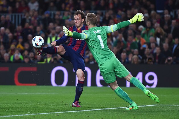 BARCELONA, SPAIN - MARCH 18: Ivan Rakitic of Barcelona lifts the ball over Joe Hart of Manchester City to score the opening goal during the UEFA Champions League Round of 16 second leg match between Barcelona and Manchester City at Camp Nou on March 18, 2015 in Barcelona, Spain.  (Photo by Michael Regan/Getty Images)