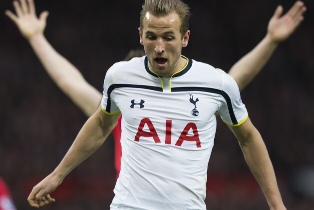 Tottenham Hotspur's Harry Kane is seen ahead of Manchester United's Phil Jones during the English Premier League soccer match between Manchester United and Tottenham Hotspur at Old Trafford Stadium, Manchester, England, Sunday March 15, 2015. (AP Photo/Jon Super)