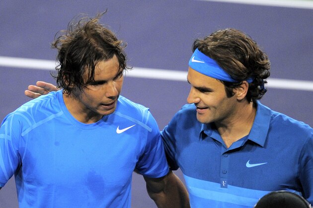 Rafael Nadal, left, of Spain, congratulates Roger Federer, of Switzerland, after Federer won their semifinal at the BNP Paribas Open tennis tournament, Saturday, March 17, 2012, in Indian Wells, Calif. Federer won 6-3, 6-4. (AP Photo/Mark J. Terrill)