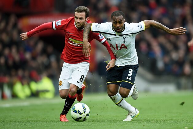 MANCHESTER, ENGLAND - MARCH 15:  Juan Mata of Manchester United and Danny Rose of Spurs battle for the ball during the Barclays Premier League match between Manchester United and Tottenham Hotspur at Old Trafford on March 15, 2015 in Manchester, England.  (Photo by Michael Regan/Getty Images)