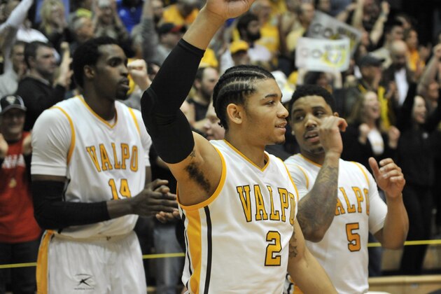Valparaiso players Tevonn Walker (2), Darien Walker (5) and Vashil Fernandez (14) celebrate their victory in an NCAA college basketball game Tuesday March 10, 2015 in Valparaiso, Ind. (AP Photo/Joe Raymond)