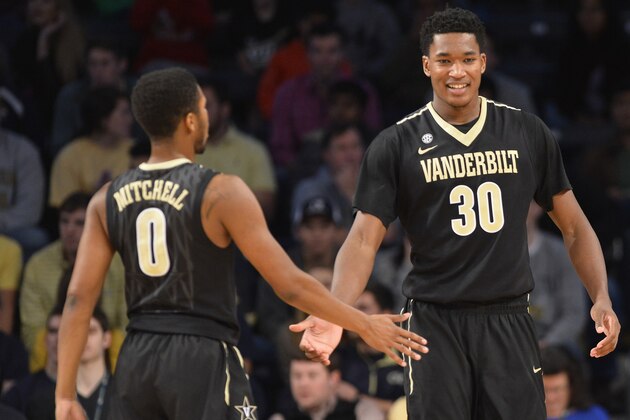 Vanderbilt center Damian Jones (30) and guard Shelton Mitchell (0) react after scoring against Georgia Tech during the second half of their NCAA college basketball game Saturday, Dec. 20, 2014, in Atlanta. Georgia Tech won 65-60. (AP Photo/David Tulis)